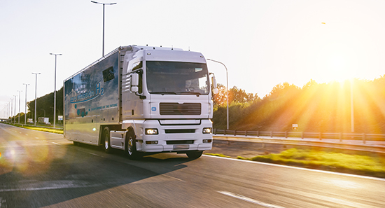 Truck with hydrogen logo. h2 combustion engine for emission free ecofriendly transport.